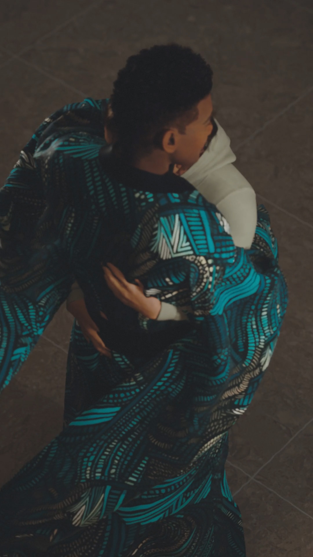 Two people hugging each other